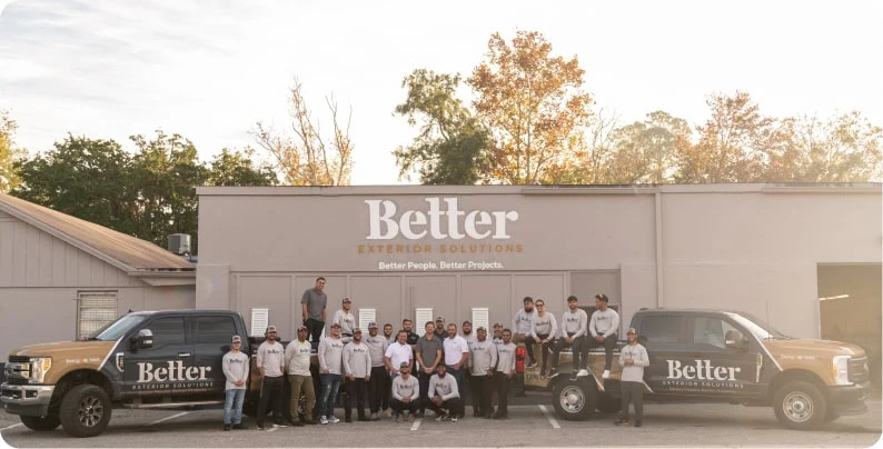 A photo of the whole Better Exteriors team outside the better exteriors